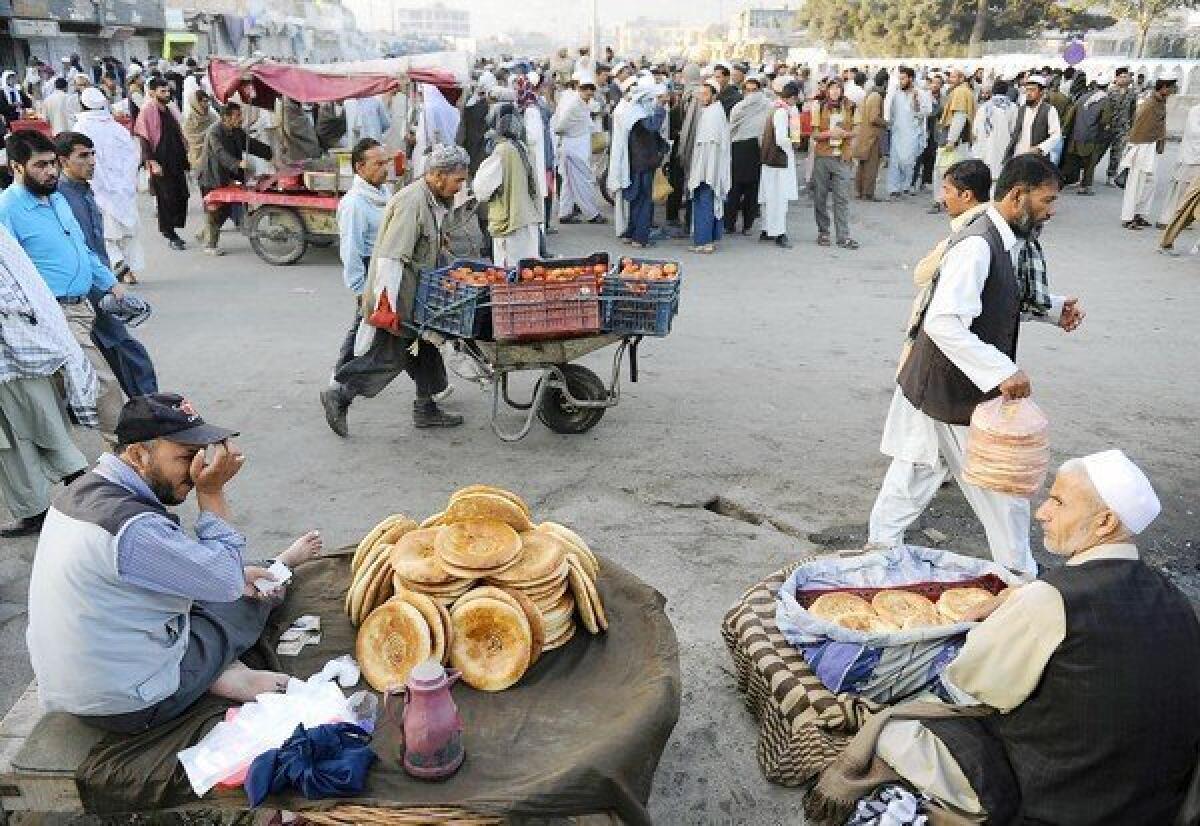 Street vendors offer goods at a market in Kabul, Afghanistan. There is a growing sense of unease among Afghans as foreign troops prepare to withdraw from the country.