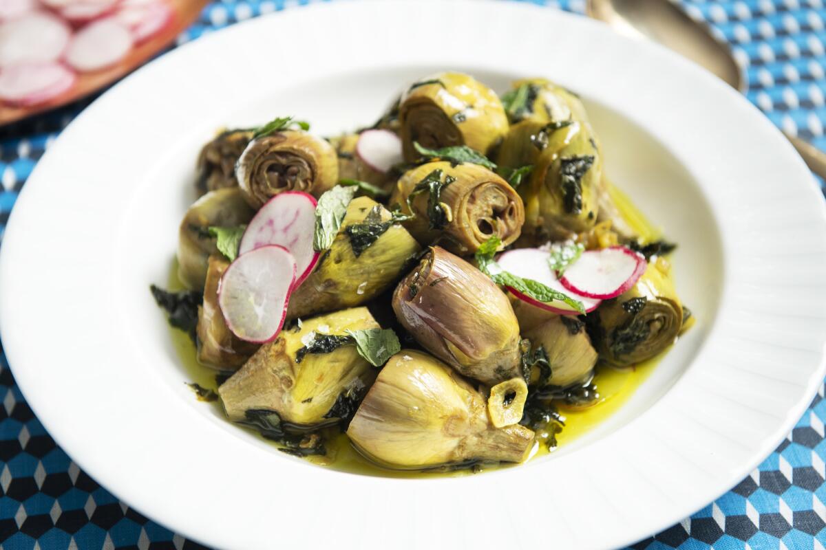 A plate of herbed confit baby artichokes