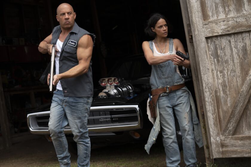 This image released by Universal Pictures shows Vin Diesel, left, and Michelle Rodriguez in a scene from "F9: The Fast Saga."