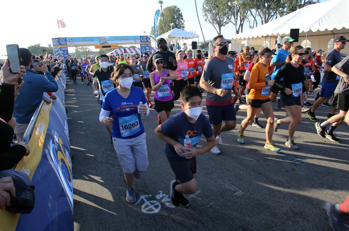 Runners of all ages at the start of the 5K Run/Walk at the OC Fair and Event Center on Saturday. 