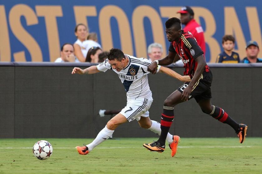 Galaxy captain Robbie Keane, left, operates against AC Milan's Mbaye Niang in the third-place match of the Guinness International Champions Cup tournament at Miami Gardens, Fla., on Aug. 7.