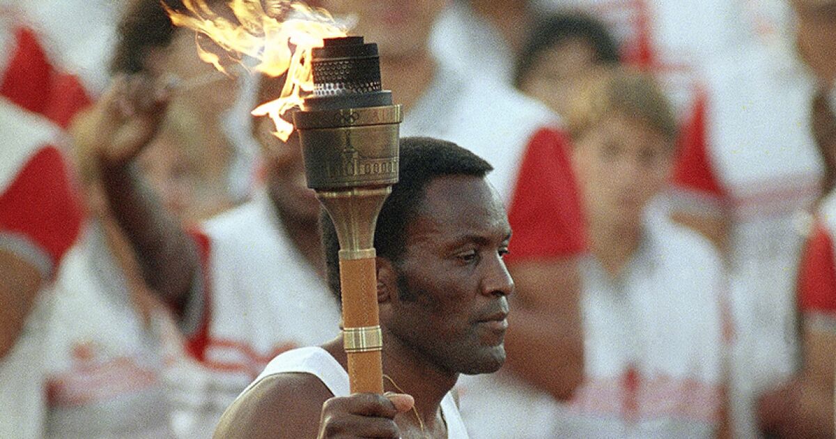 Rafer Johnson lighting Olympic flame in ’84 ultimate moment for Coliseum, his family