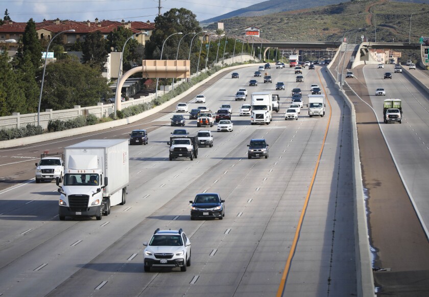 With schools and many businesses closed due to the coronavirus outbreak, traffic on southbound Interstate 15, near Carroll Canyon Road, in Mira Mesa, was unusually light during what is generally very heavy in the morning, March 17, 2020 in San Diego, California.
