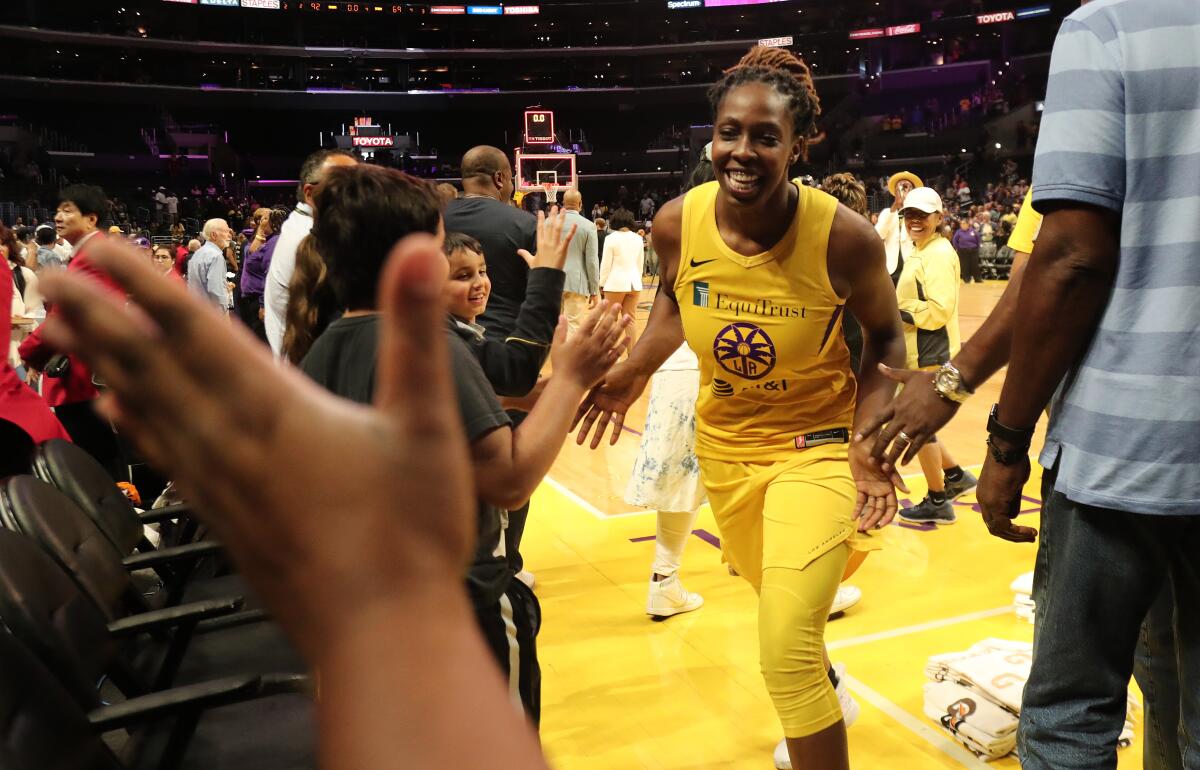 Sparks guard Chelsea Gray is congratulated s after a 92-69 victory over the Seattle Storm in a playoff game on Sept. 15, 2019, at Staples Center.