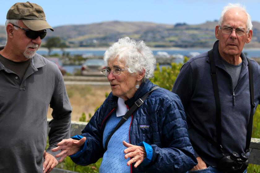 Times columnist Steve Lopez, left, with Lucy Kortum, whose late husband Bill Kortum helped lead the seminal battle to protect public access to the California coast, and environmentalist Pete Leveque.