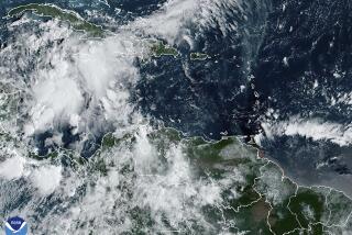 This image provided by the National Oceanic and Atmospheric Administration shows a cluster of storms located south of the Cayman Islands which are expected to strengthen in upcoming days, Monday, Sept. 23, 2024. (NOAA via AP)