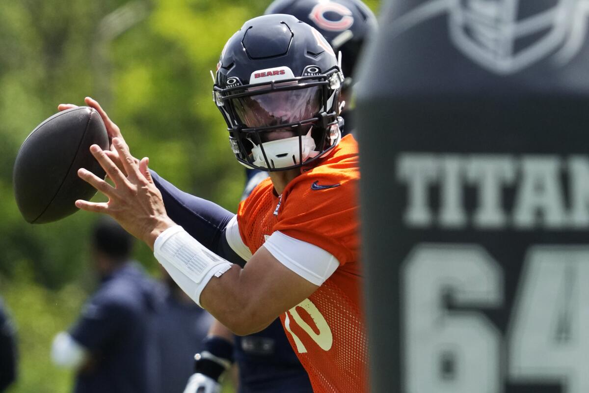 Chicago Bears quarterback Caleb Williams throws during a drill during practice in Lake Forest, Ill.,