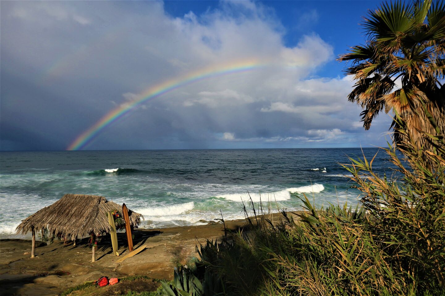 A rainbow adds to the scenery beyond the Windansea Beach surf shack.