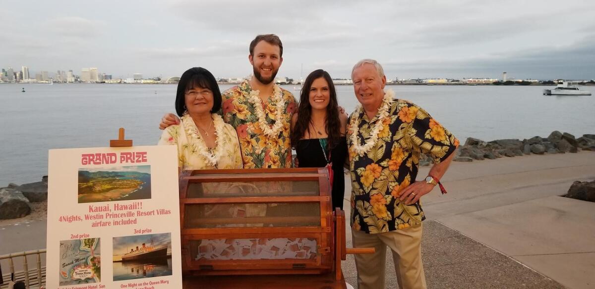Optimist Club members Terry and Tom Lewis (far left and far right), pose with Optimist Collin Clifford and fiancee Becky Campbell. “He just bought his first Hawaiian shirt today!” Campbell said with a laugh.