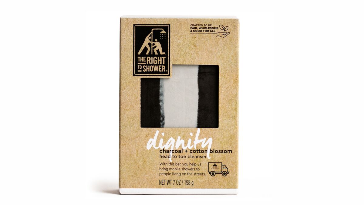 Dignity Charcoal and Cotton Blossom Bar Soap from the Right to Shower.