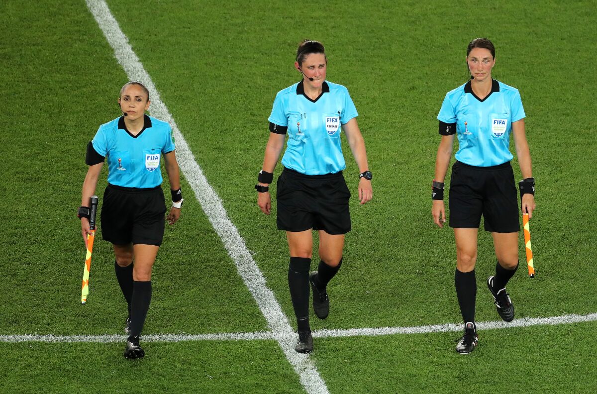 From left, Kate Jacewicz, Kathryn Nesbitt, Felisha Mariscal leave the pitch after the 2019 FIFA Women's World Cup match. 