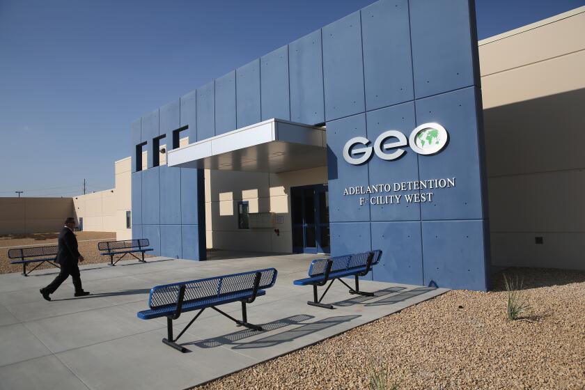 ADELANTO, CA - NOVEMBER 15: Field office director Dave Marin walks into the Adelanto Detention Facility on November 15, 2013 in Adelanto, California. The facility, the largest and newest Immigration and Customs Enforcement (ICE), detention center in California, houses an average of 1,100 immigrants in custody pending a decision in their immigration cases or awaiting deportation. The average stay for a detainee is 29 days. The facility is managed by the private GEO Group. ICE detains an average of 33,000 undocumented immigrants in more than 400 facilities nationwide. (Photo by John Moore/Getty Images)