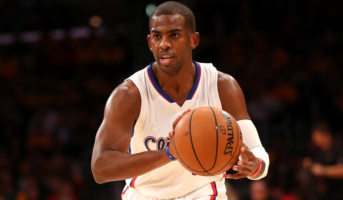 Clippers point guard Chris Paul initiates the offense during the 118-111 victory over the Lakers on Friday night at Staples Center.