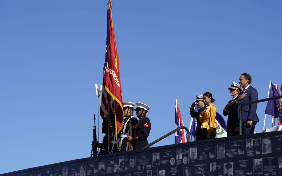 The Marine color guard presents the colors during the Pledge of Allegiance.
