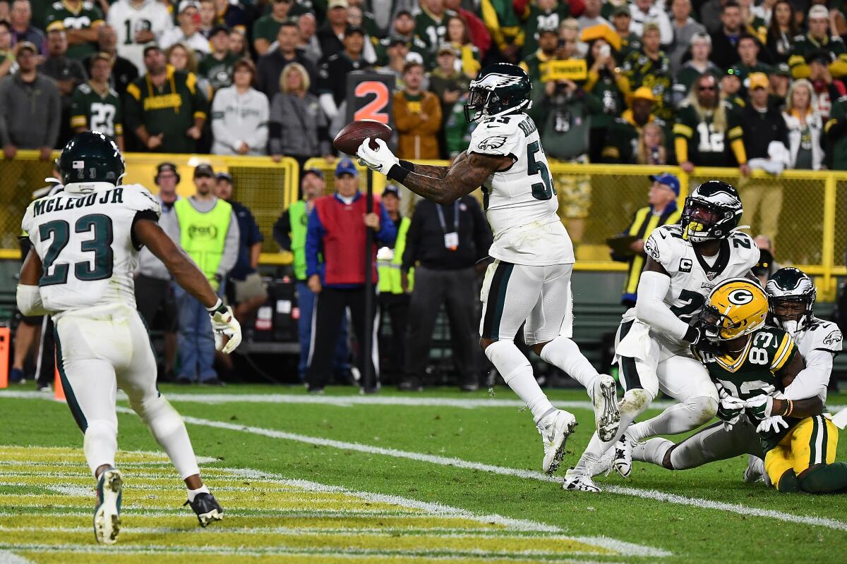 Philadelphia Eagles' Nigel Bradham (53) intercepts a pass in the endzone during the fourth quarter against the Green Bay Packers at Lambeau Field on Thursday in Green Bay, Wisc.