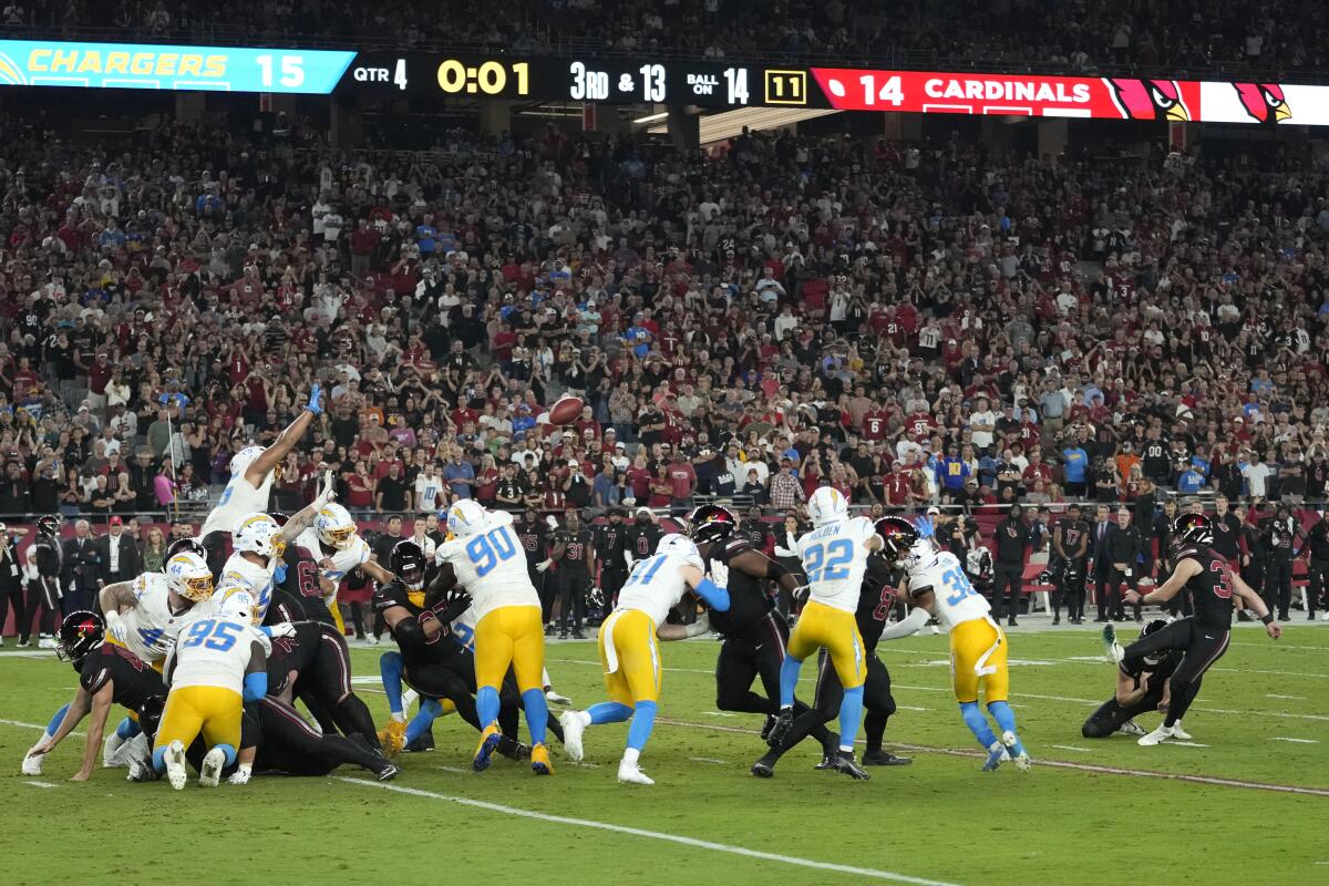 Arizona's Chad Ryland, right, kicks a 32-yard field goal as time expires to lift the Cardinals to a 17-15 win.