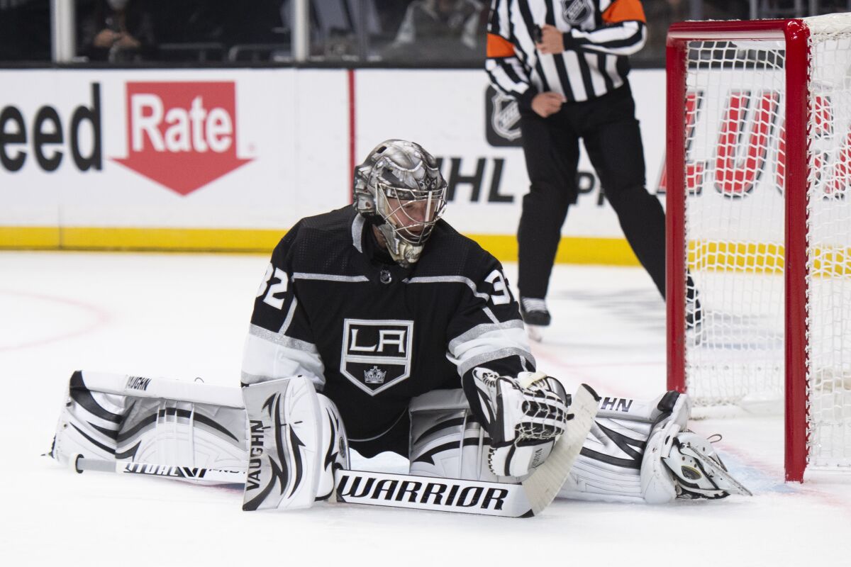 Los Angeles Kings goaltender Jonathan Quick catches a shot during the first period of the team's NHL hockey game against the St. Louis Blues on Wednesday, Nov. 3, 2021, in Los Angeles. (AP Photo/Kyusung Gong)