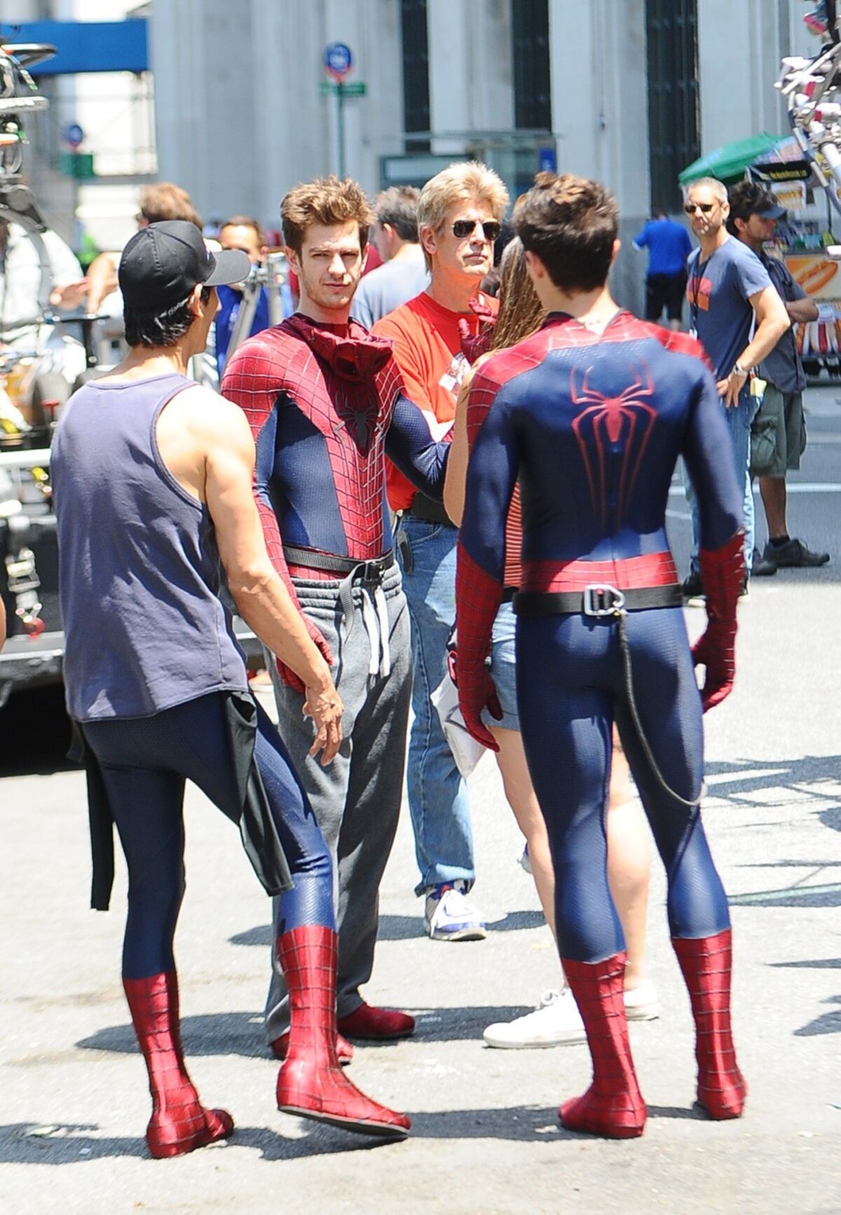 Actor Andrew Garfield, center left, is seen on the set of "The Amazing Spider-Man 2" in New York City with his stunt double William Spencer, right, and a second stunt double.