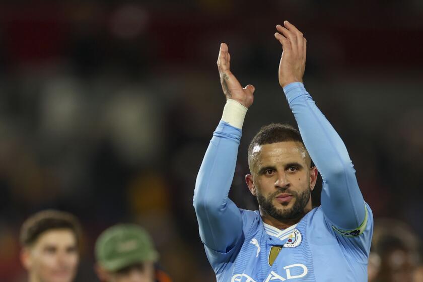 Manchester City's Kyle Walker celebrates at the end of the English Premier League soccer match between Brentford and Manchester City at the Gtech Community Stadium in London, Monday, Feb. 5, 2024. (AP Photo/Ian Walton)