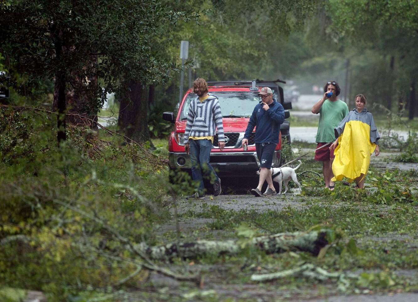 Residents look at downed trees as Hurricane Florence passes over Wilmington, N.C.