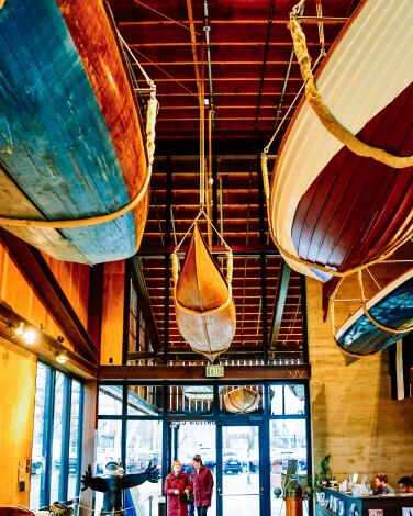 Boats hanging from ceiling at Center for Wooden Boats. 