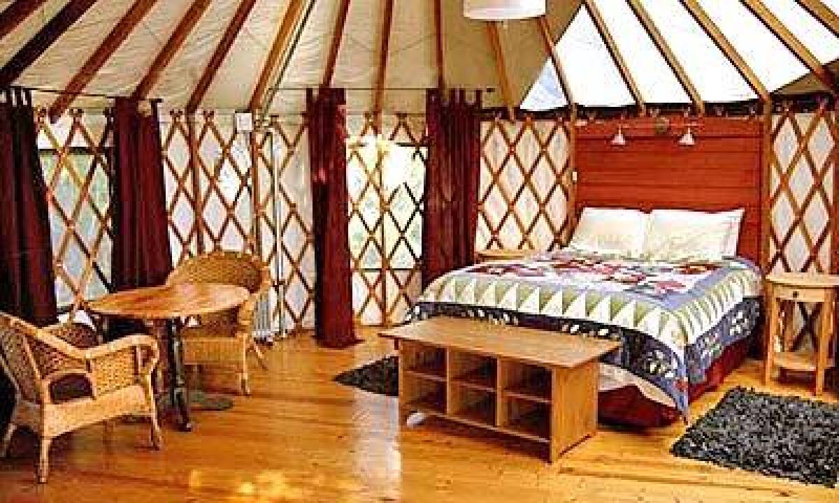 Treebones' yurts are furnished with a comfortable bed and chairs, pine floors, electric lights and a portable heater.