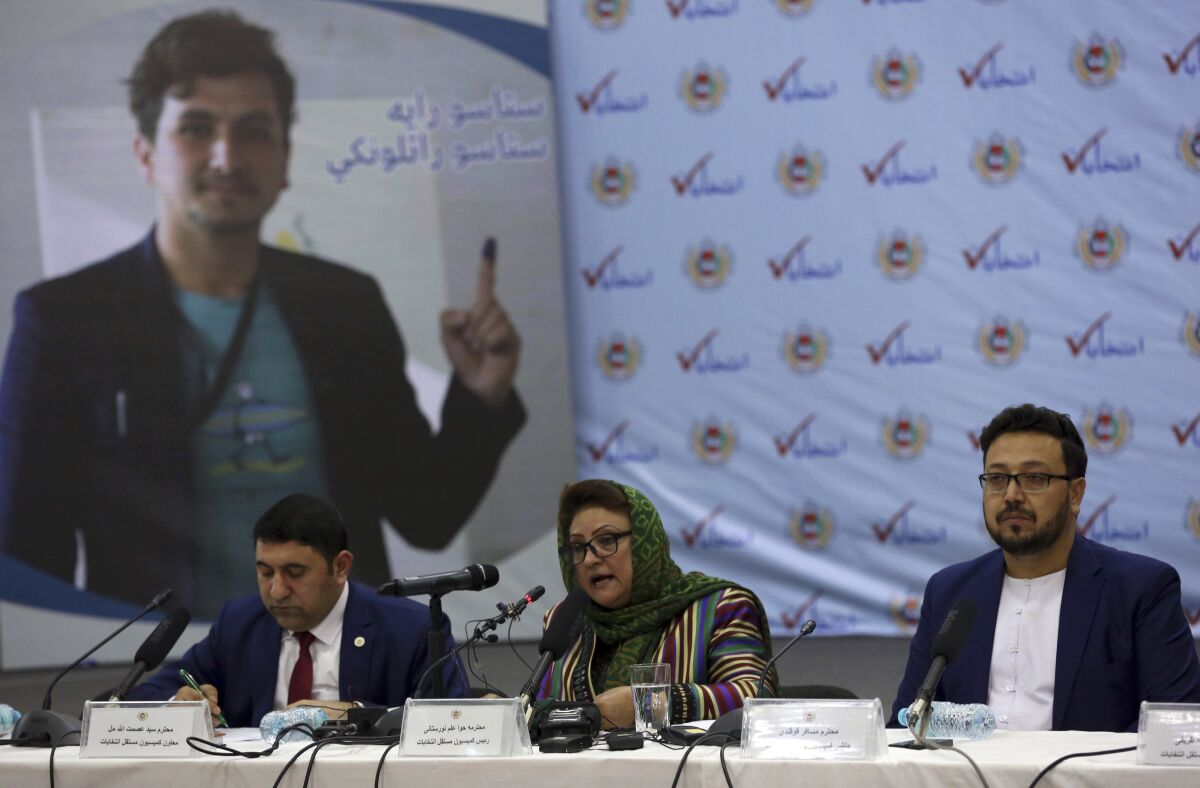 A woman speaks at an Afghan news conference.