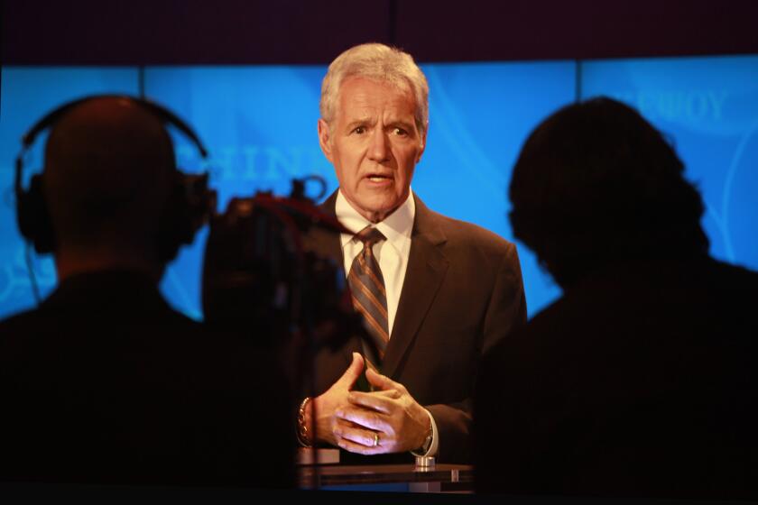 The host of Jeopardy, Alex Trebek, rehearses for the upcoming show.