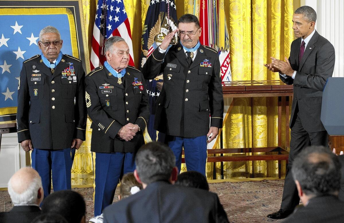 President Obama at the White House with three Medal of Honor recipients, from left: Melvin Morris, Jose Rodela and Santiago Jesse Erevia.