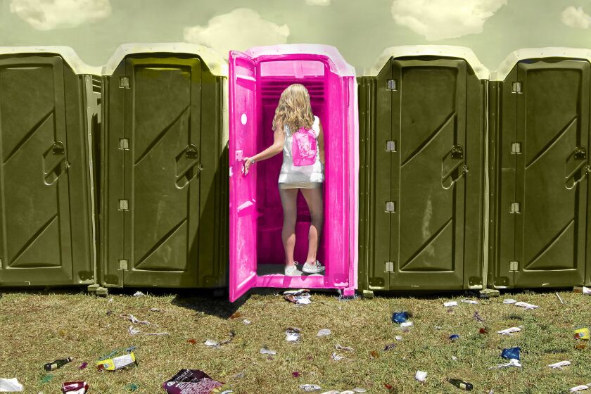 A woman heads into a portable toilet armed with the Stand Up.