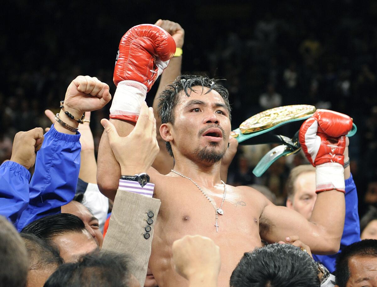 Manny Pacquiao is lifted after defeating Oscar de la Hoya on Dec. 6, 2008.