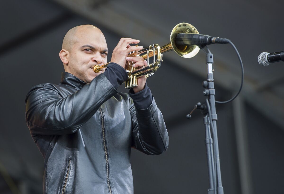 FILE - In this May 4, 2017 file photo, Irvin Mayfield performs at the New Orleans Jazz and Heritage Festival in New Orleans. Mayfield, the jazz trumpet player who became a symbol of New Orleans resilience after Hurricane Katrina, was scheduled to be sentenced in federal court Wednesday, Nov. 3, 2021, for steering charity money meant for public libraries to his personal use.(Photo by Amy Harris/Invision/AP, File)
