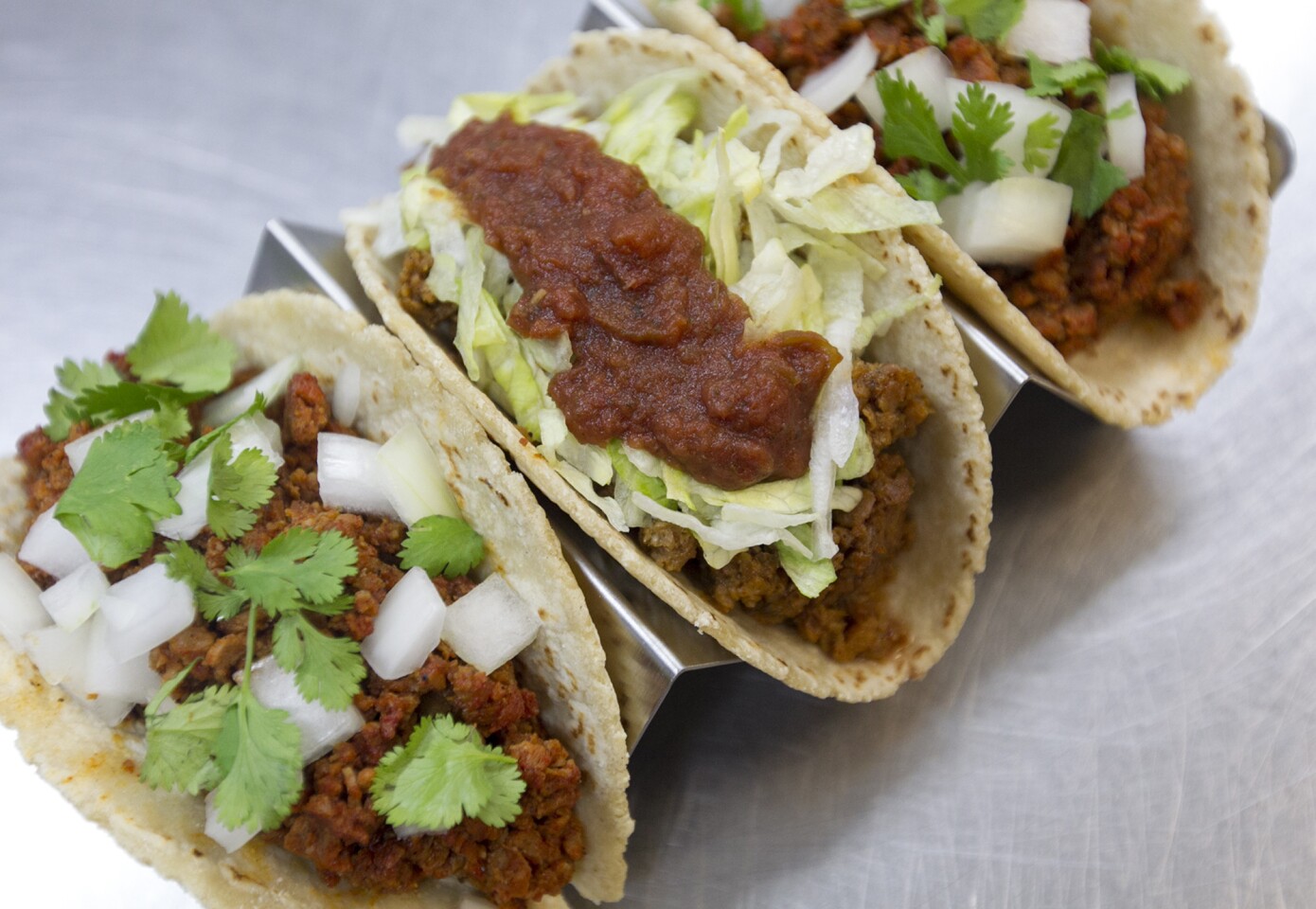 Spanish "chorizo" and ground "beef" tacos are made with plant-based protein from The Abbot's Butcher, a Costa Mesa vegan "meat" company.