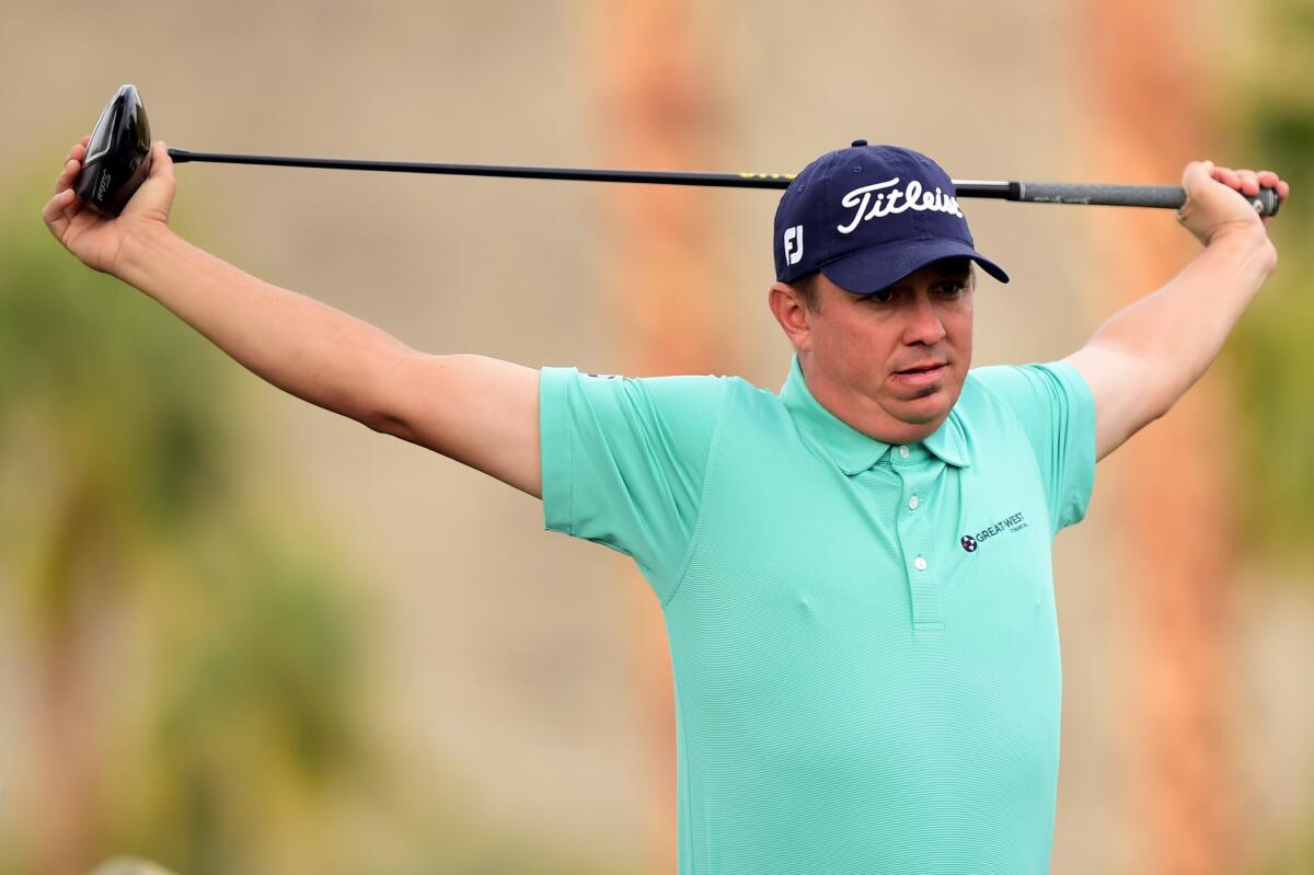 Jason Dufner stretches before playing his tee shot on the 11th hole during the third round of the CareerBuilder Challenge in La Quinta, California on Jan. 23.