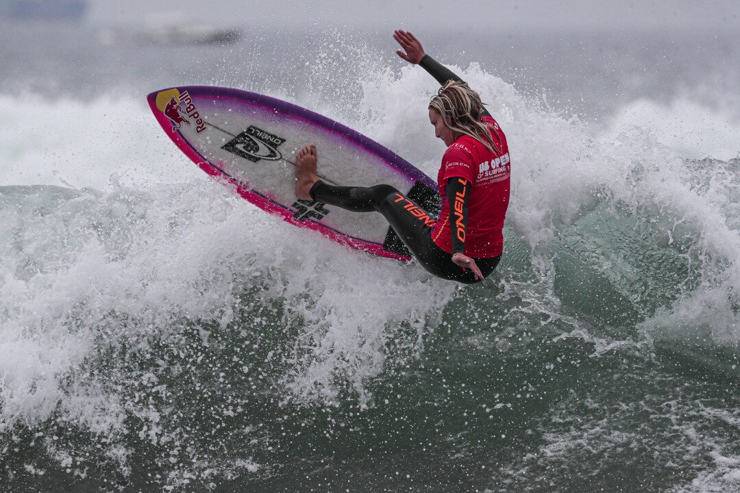 Caity Simmers competes in a preliminary run to qualify for the finals of the US Open of Surfing