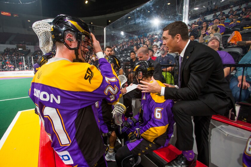 San Diego Seals General Manager and Head Coach Patrick Merrill (right) addresses his team during a 2019 game.