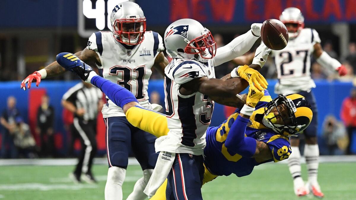 Patriots cornerback Jason McCourty, left, breaks up a pass intended for Rams wide receiver Josh Reynolds during the first half Super Bowl LIII at Mercedes-Benz Stadium in Atlanta.