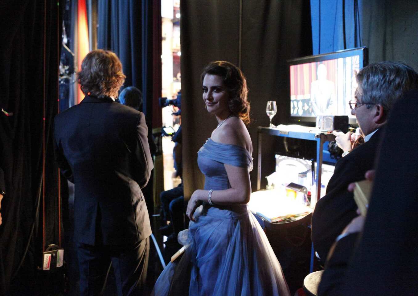 Penélope Cruz waits in the wings before presenting an Oscar at the 2012 Academy Awards in Hollywood.