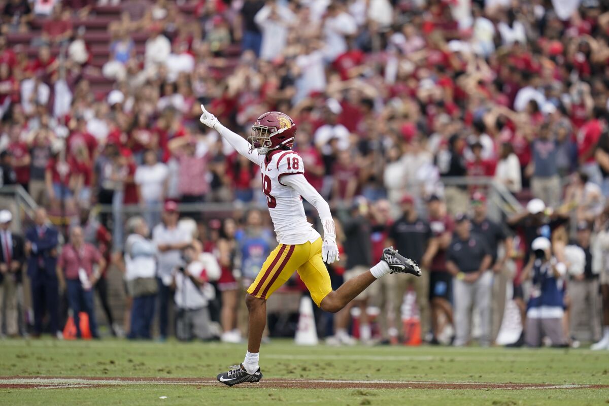 USC linebacker Eric Gentry (18) reacts after defensive back Mekhi Blackmon intercepted a pass Sept. 10, 2022.