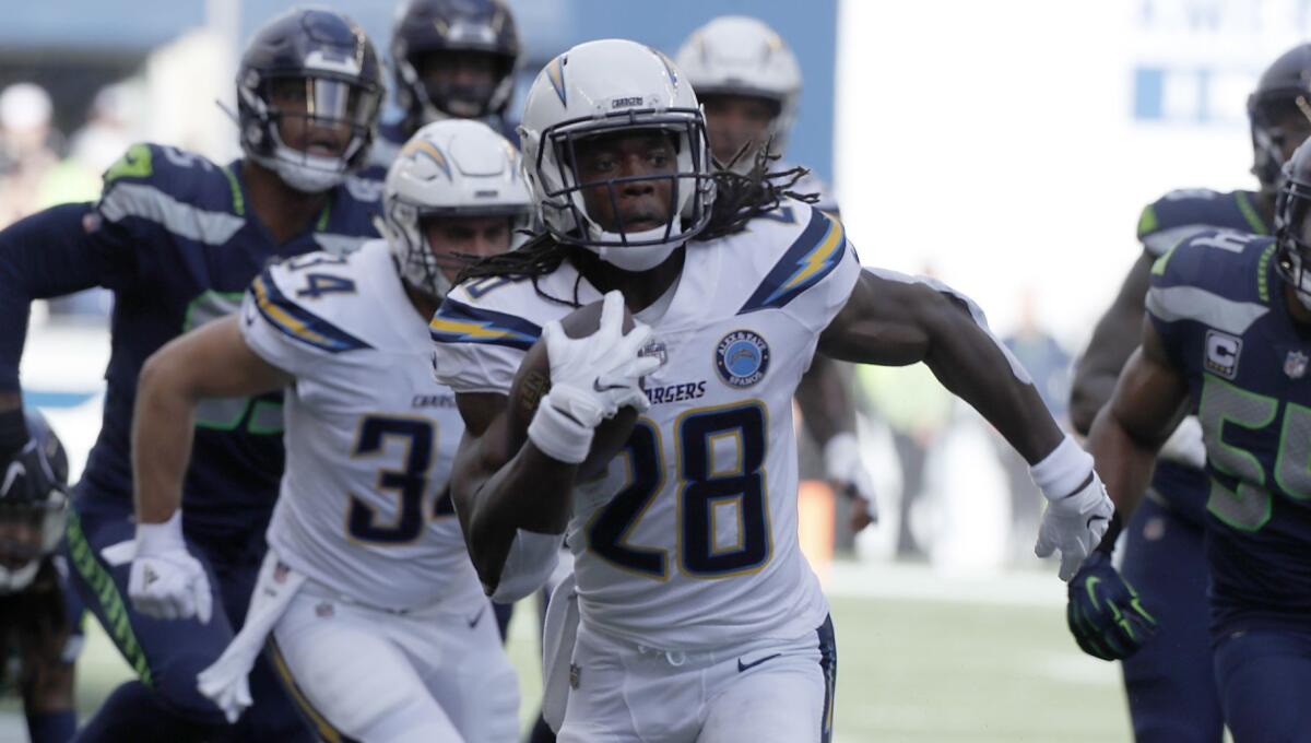 Chargers running back Melvin Gordon rushes past Seahawks defenders en route to a touchdown.