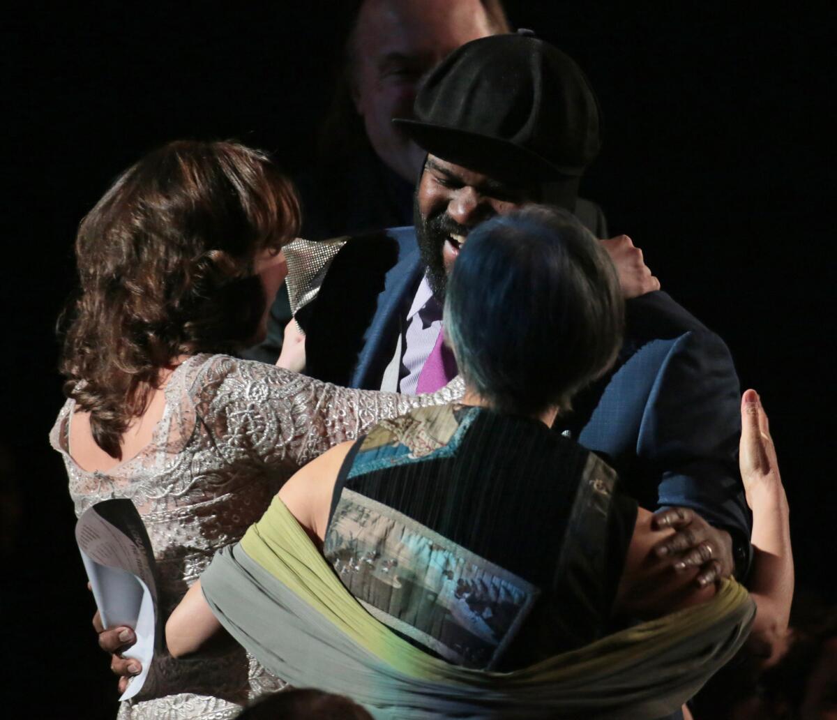 Gregory Porter rises to accept the award for best jazz vocal album at the 56th Annual Grammys pre-telecast show at Nokia Theater.