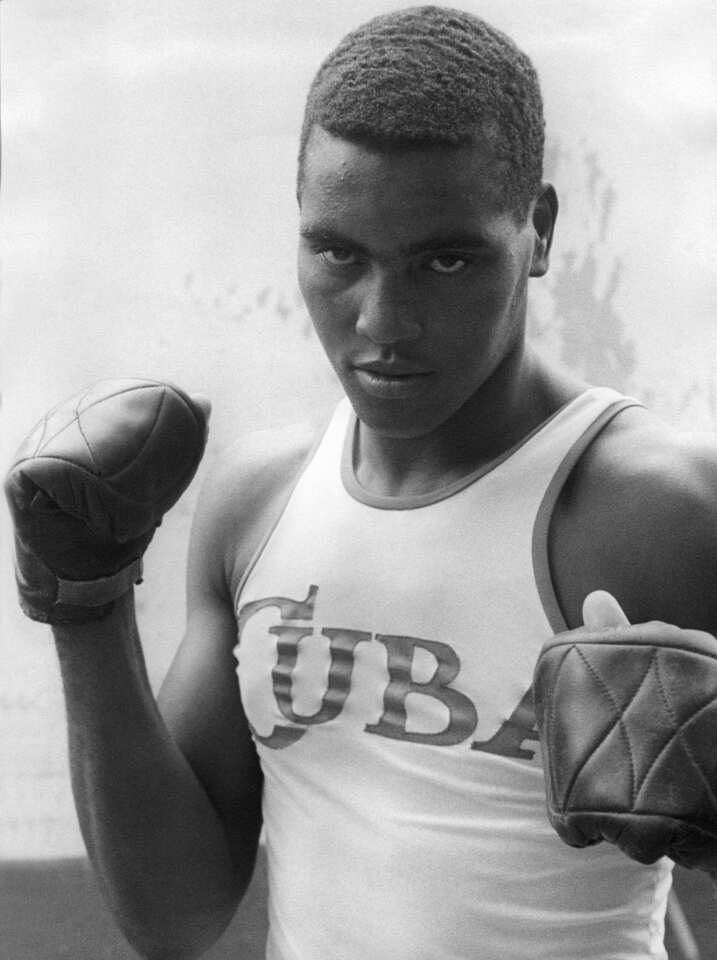 A photograph of Cuban boxing champion Teofilo Stevenson from the 1970s. Stevenson, regarded by many as the most accomplished amateur boxer in history, won three successive gold medals in the Summer Olympics (1972, 1976 and 1980) and three world amateur titles (1974, 1978 and 1986).