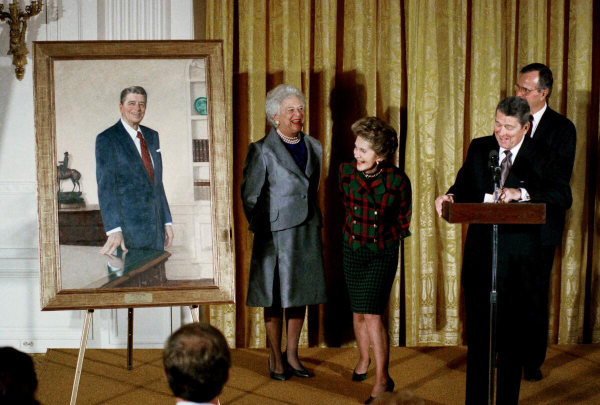 Former President Ronald Reagan and his wife Nancy with then-President George H. W. Bush 