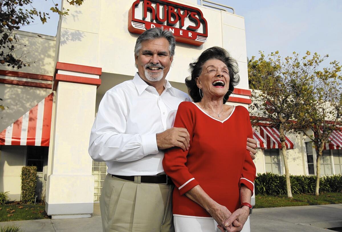 Ruby's Diner founder Doug Cavanaugh Jr. jokes with his mother, Ruby, in front of his Tustin restaurant in 2012. Ruby Cavanaugh died Sunday at age 93.