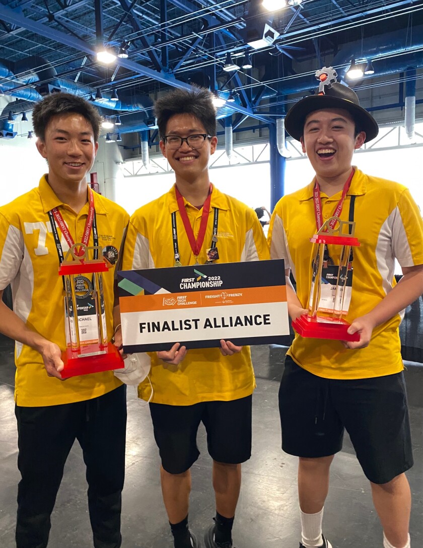 Michael Zeng, Nicolas Liu and James Hou (from left) with their awards