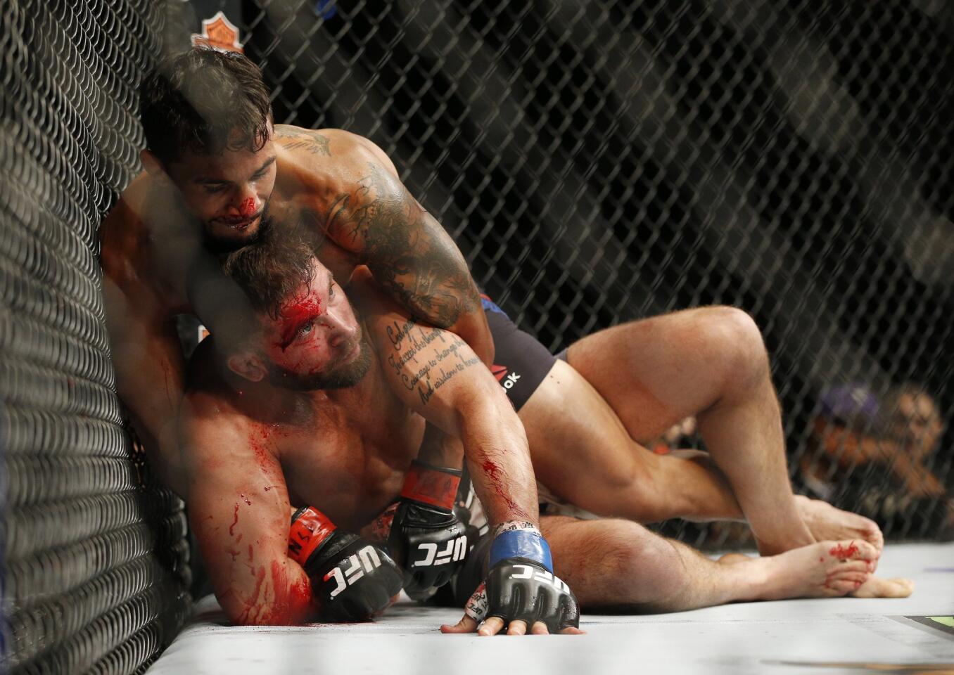 APphoto_UFC 189 Mixed Martial Arts