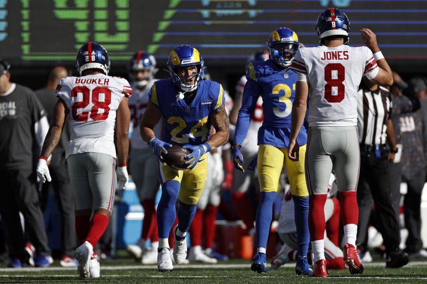 Los Angeles Rams free safety Taylor Rapp (24) reacts after intercepting New York Giants quarterback Daniel Jones (8) during an NFL football game, Sunday, Oct. 17, 2021, in East Rutherford, N.J. (AP Photo/Adam Hunger)