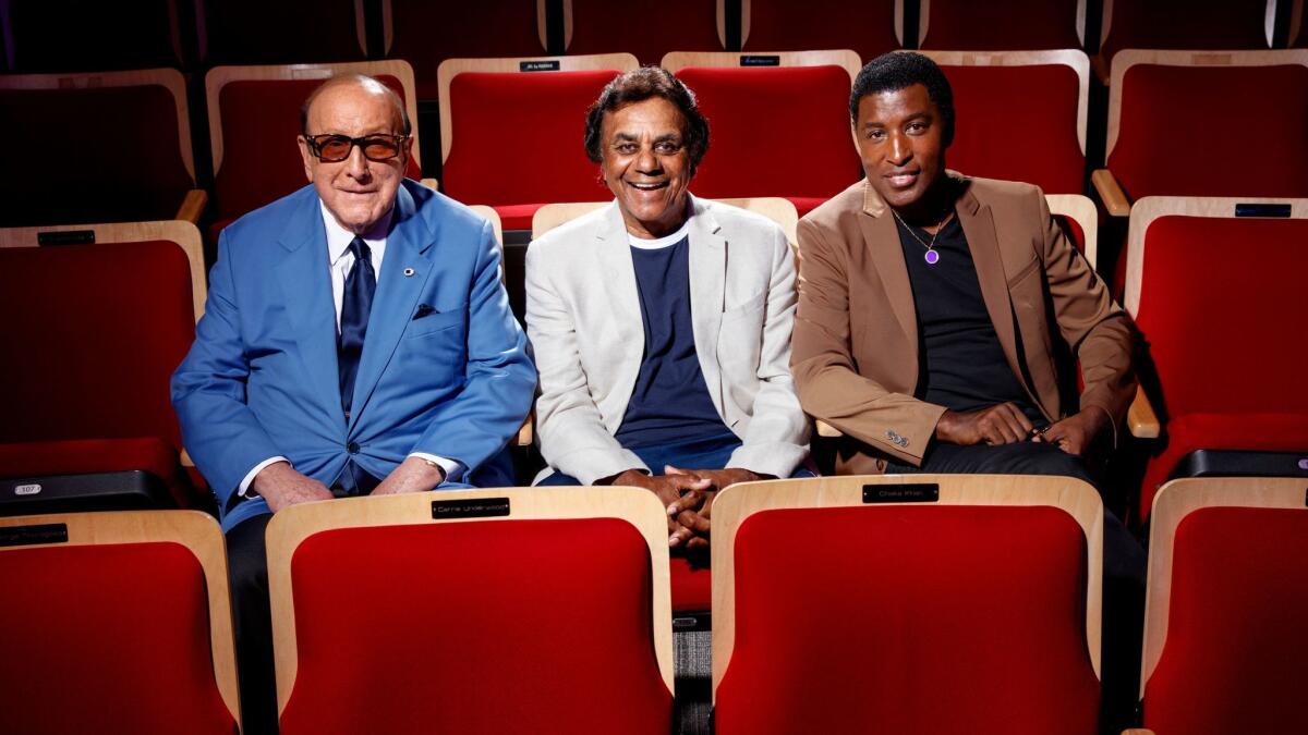 From left, Clive Davis, Johnny Mathis and Kenny "Babyface" Edmonds at the Grammy Museum in September.