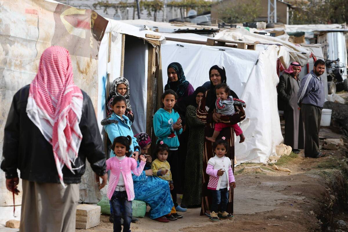 Syrian refugees at a camp in Delhamiyeh, Lebanon, are among the estimated 2 million who have fled the war in Syria. Meanwhile, more than 9 million who remain in the country are in dire need of aid as winter approaches, the United Nations says.