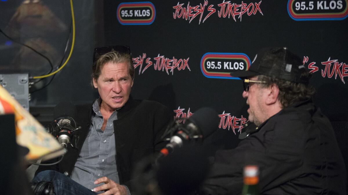 Steve Jones, right, a guitarist from the punk band Sex Pistols and a DJ on Jonesy's Jukebox on KLOS, interviews actor Val Kilmer at KLOS.